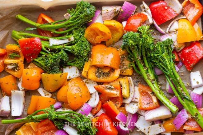 roasting vegetables: broccolini, red onion, and bell peppers