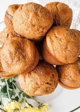 Healthy Pumpkin Spice Muffins stacked on a serving dish