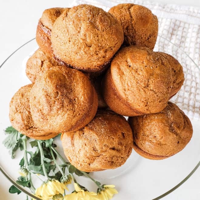 Healthy Pumpkin Spice Muffins stacked on a serving dish