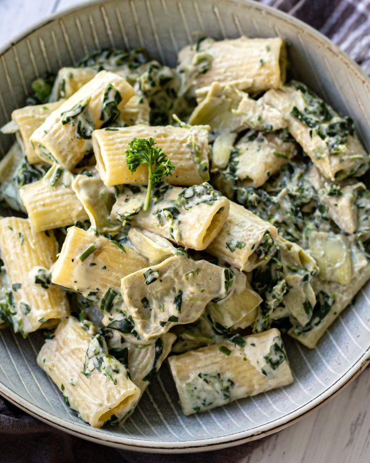 Spinach artichoke pasta bake in a bowl