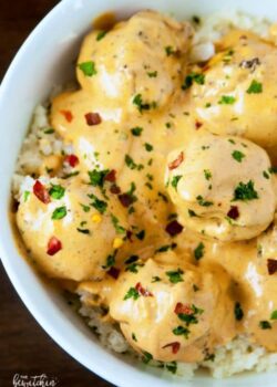 bowl of curry chicken meatballs over cauliflower rice