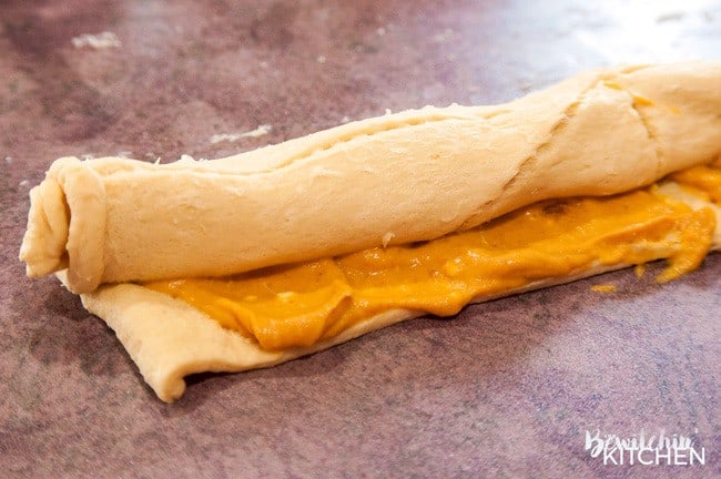 crescent dough rolled and filled with pumpkin pie filling