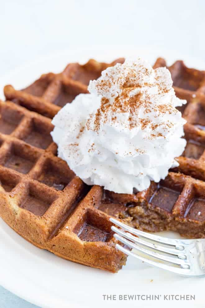 gluten free waffle topped with whipped cream and cinnamon