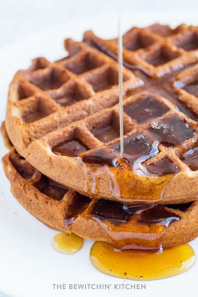 drizzling syrup onto vegan gluten free waffles