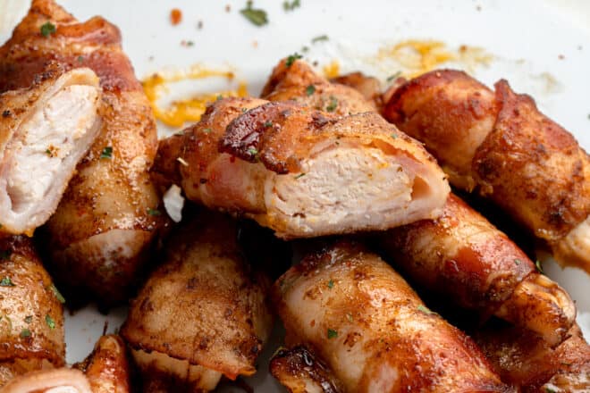 Baked bacon wrapped chicken tenders on plate