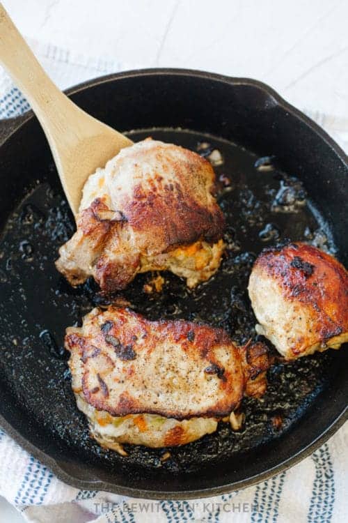 apple stuffed pork loin in a cast iron skillet