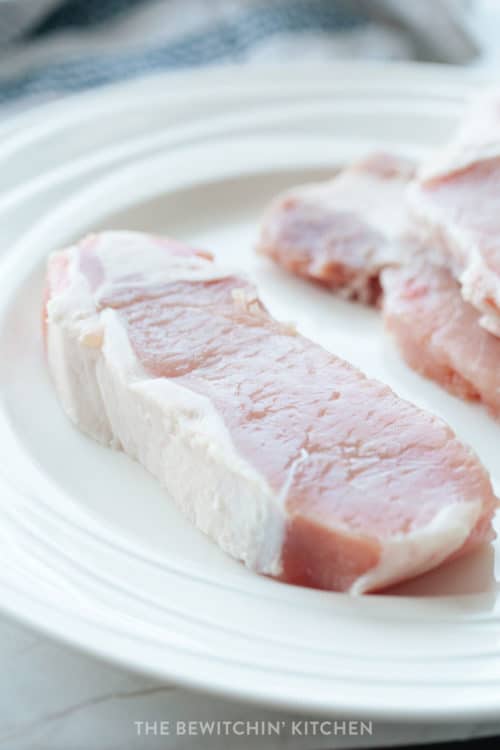 raw pork chops before flattening for stuffed pork chops recipe