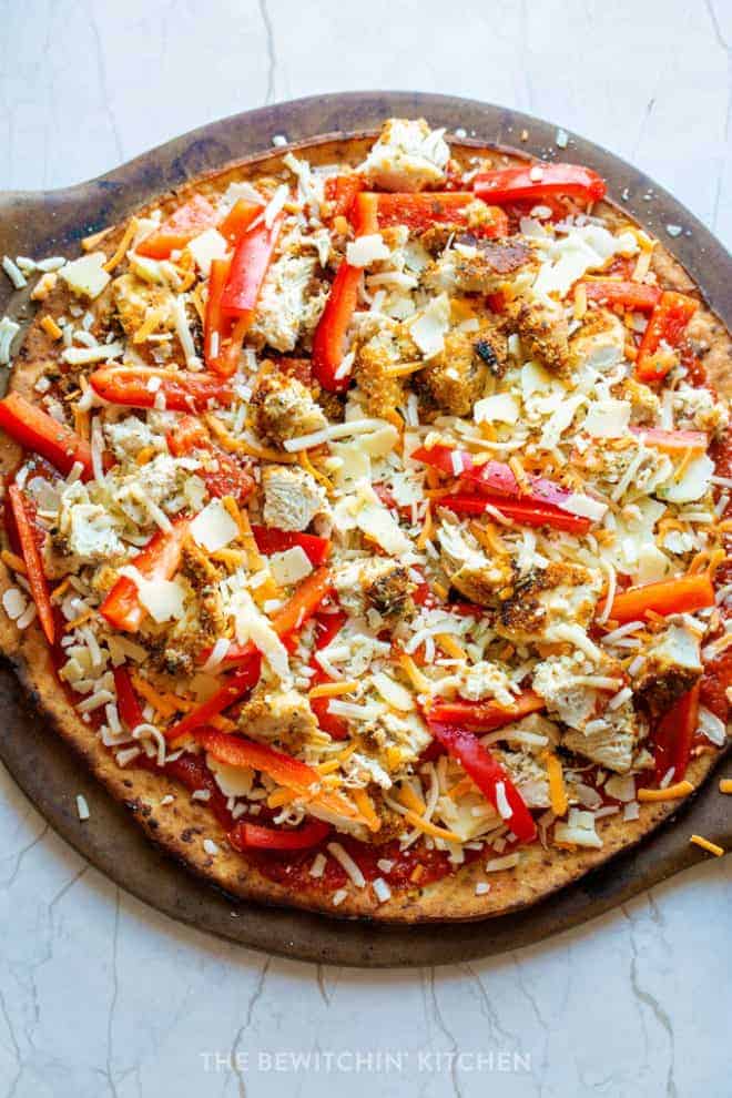 gluten free chicken parm pizza on a pizza stone