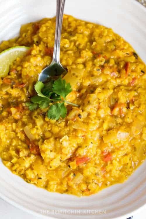 spoon in a bowl of coconut lentil curry soup