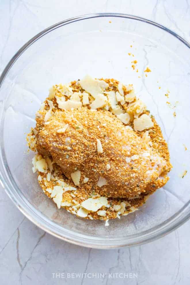 breaded chicken breast in a glass bowl