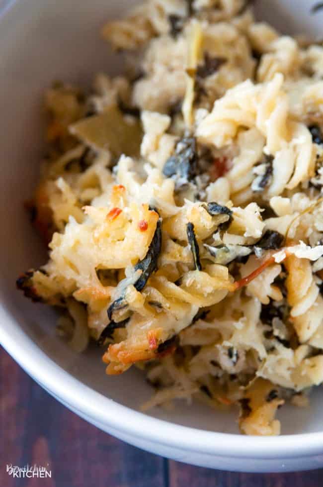 Closeup of spinach pasta bake in a bowl