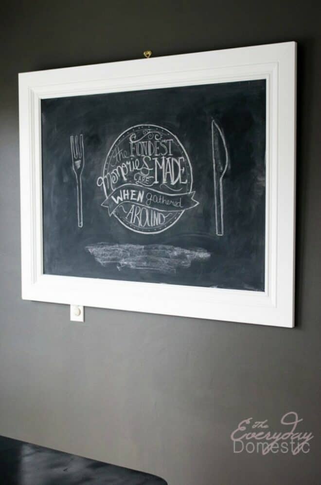 A DIY framed chalkboard hanging on a wall