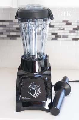 Vitamix blender with tamper on a counter