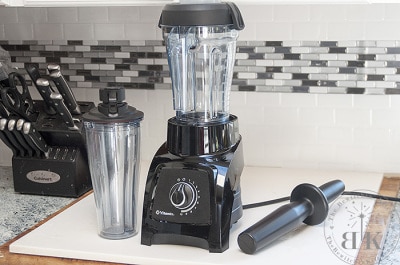 Vitamix S30 including the Vitamix personal blender and tamper on a countertop