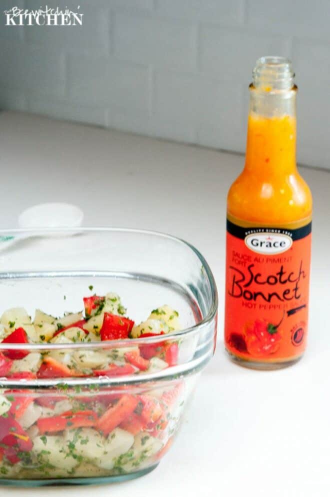 Pineapple salsa and a bottle of Grace Scotch Bonnet Hot Pepper Sauce for tropical island jerk chicken