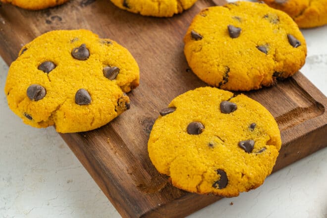 Almond flour pumpkin cookies presented on a cutting board 