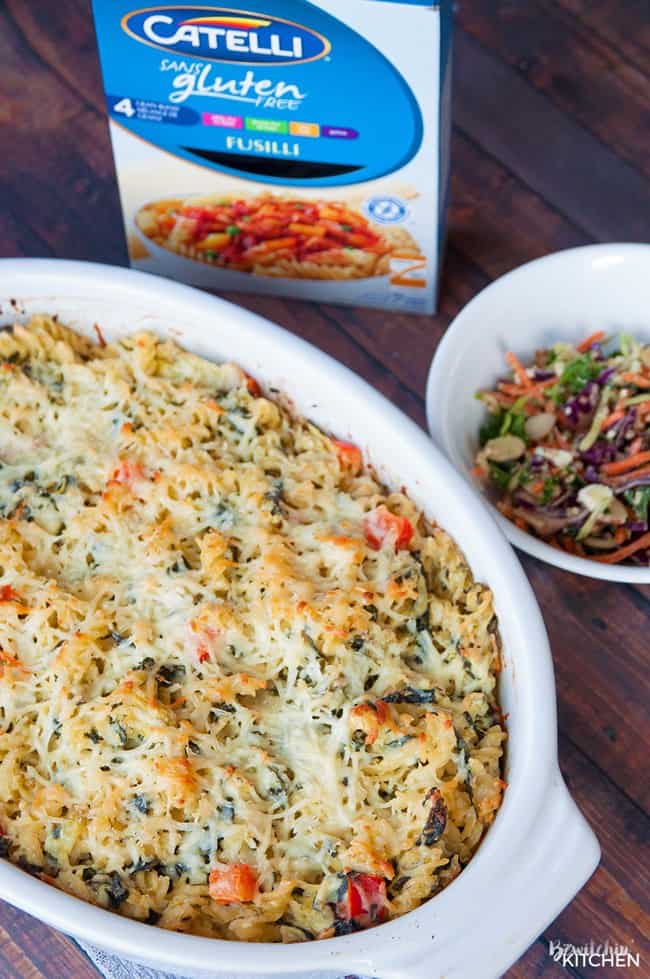 Spinach artichoke casserole in a white baking dish