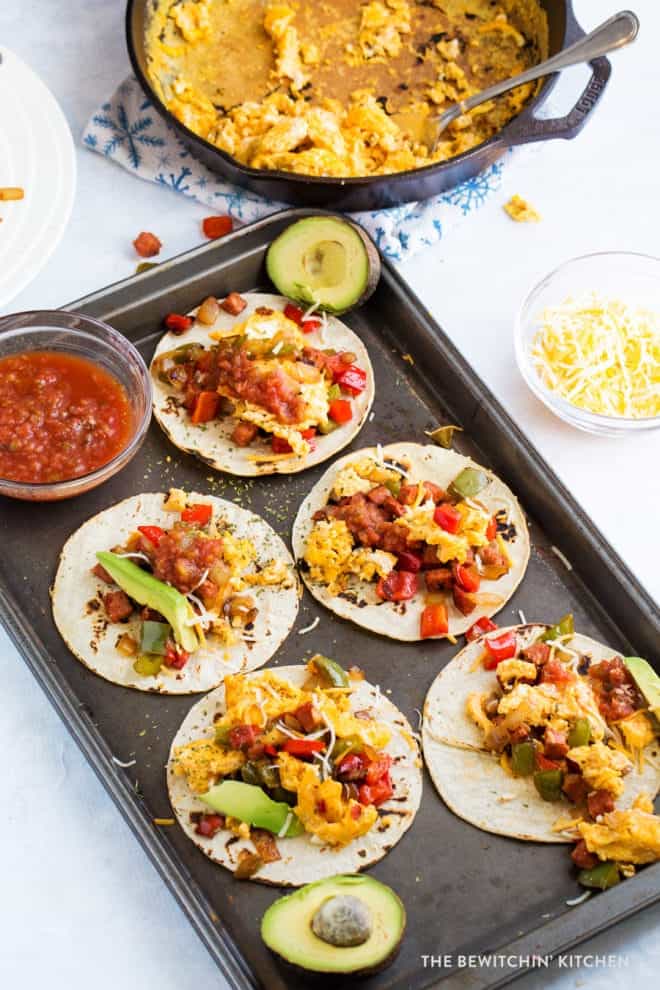 zoomed out image of 5 chorizo and egg tacos