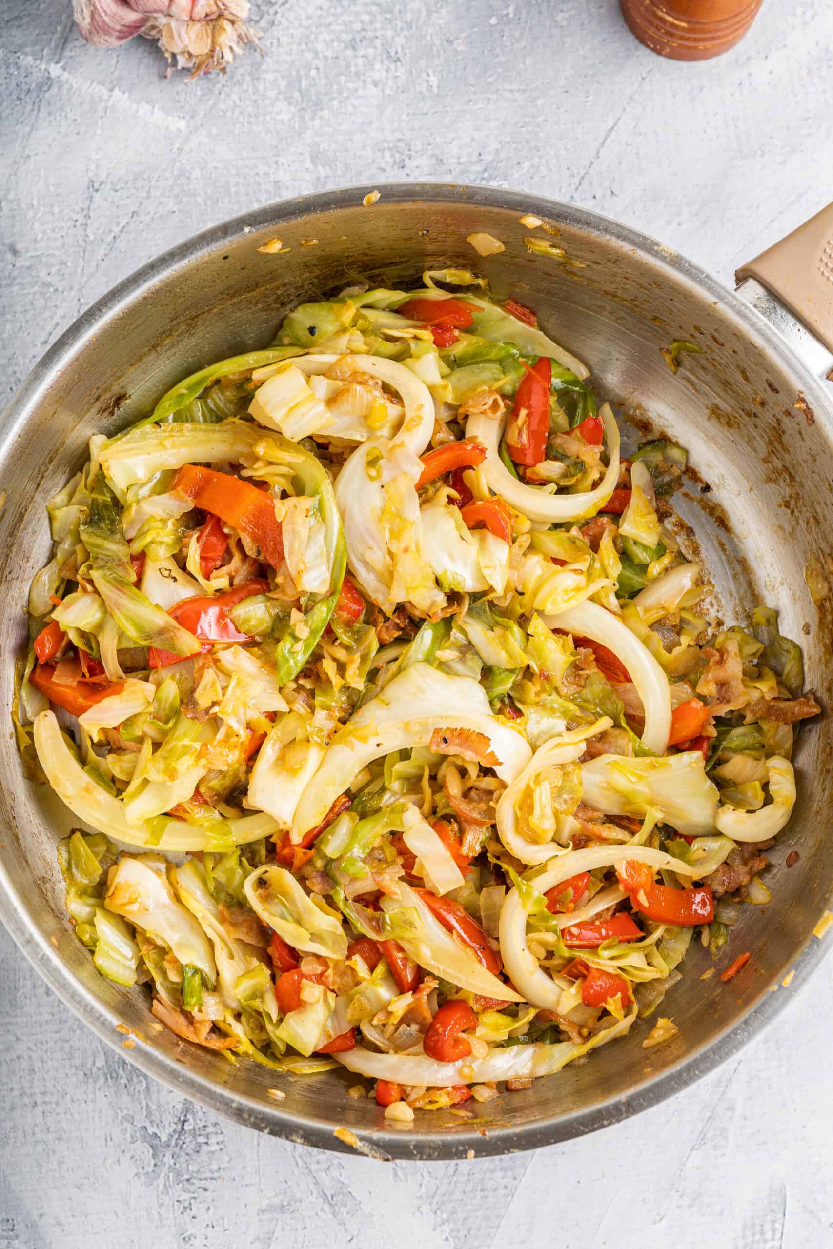 Cooked cabbage and bacon in a bowl