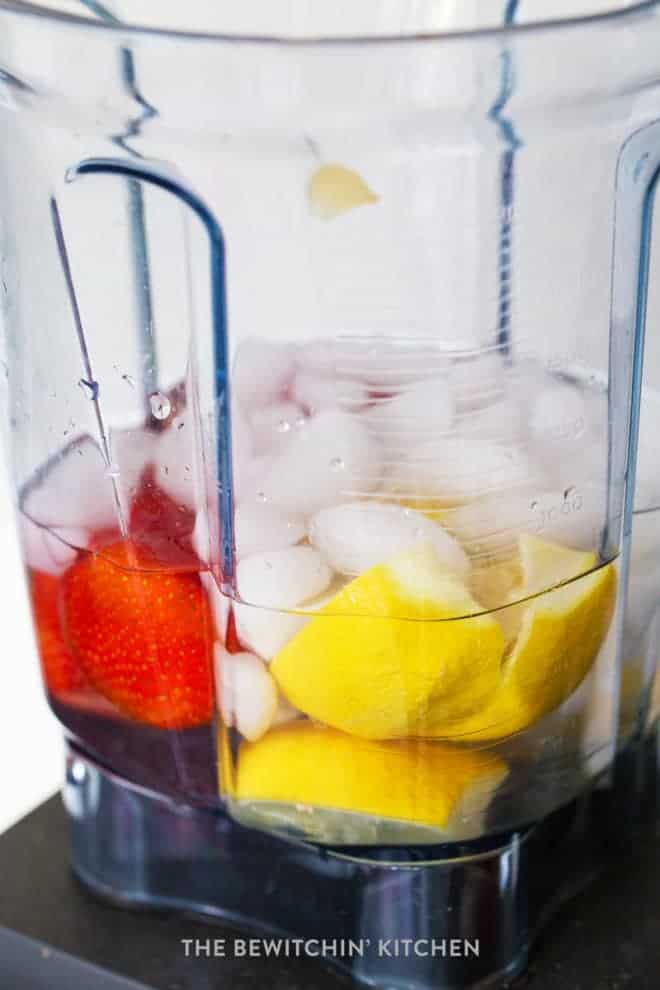 Lemon and strawberry in a blender
