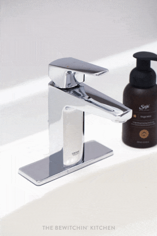 A new faucet is used to finish the look for bathroom DIY renovations