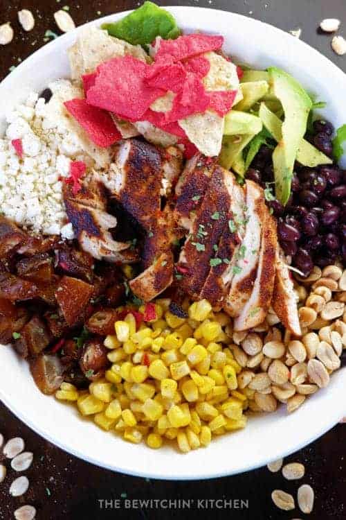 Santa Fe chicken salad recipe with vegetables, peanuts, chicken, and feta.