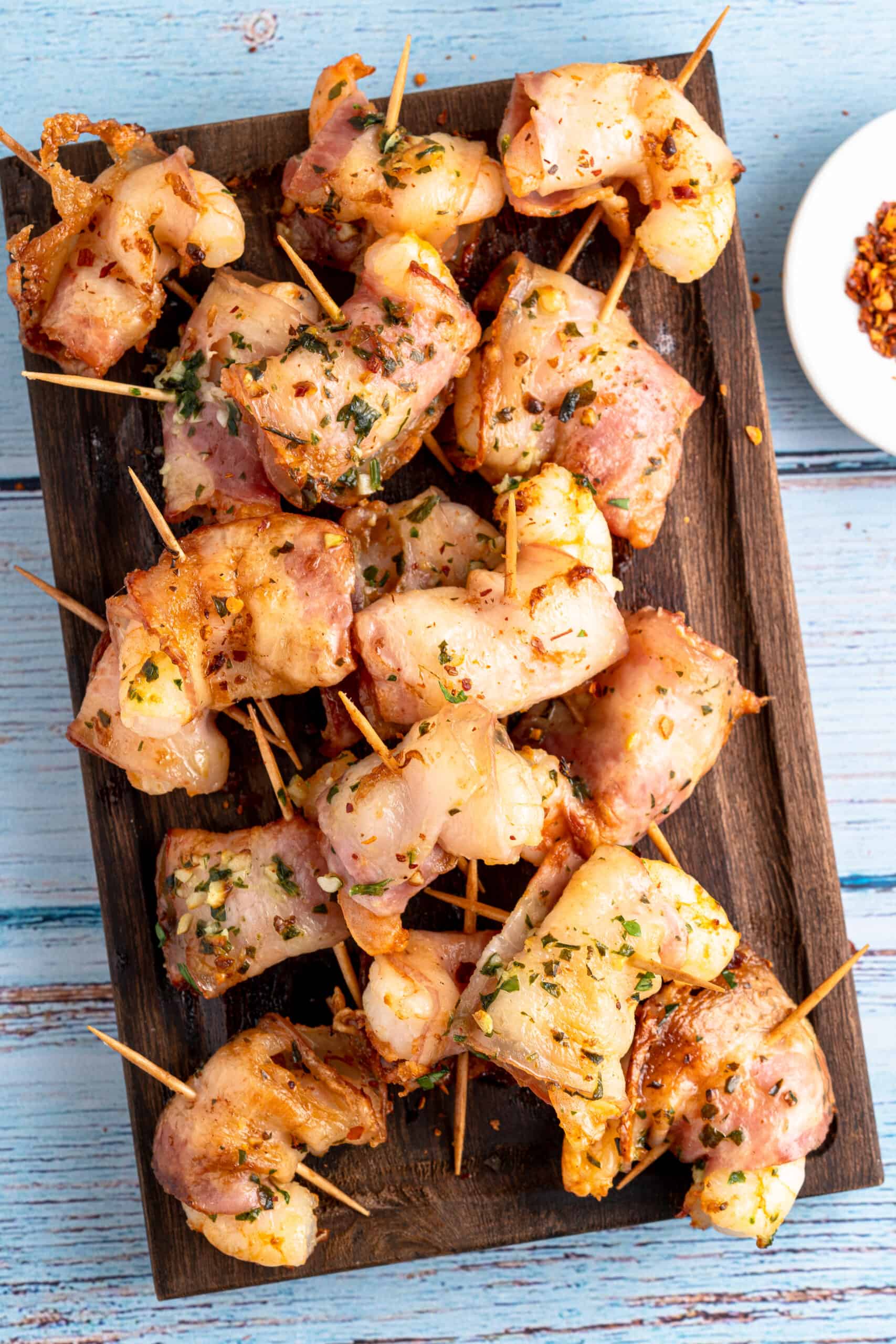 Bacon Wrapped Shrimp on a charcuterie board
