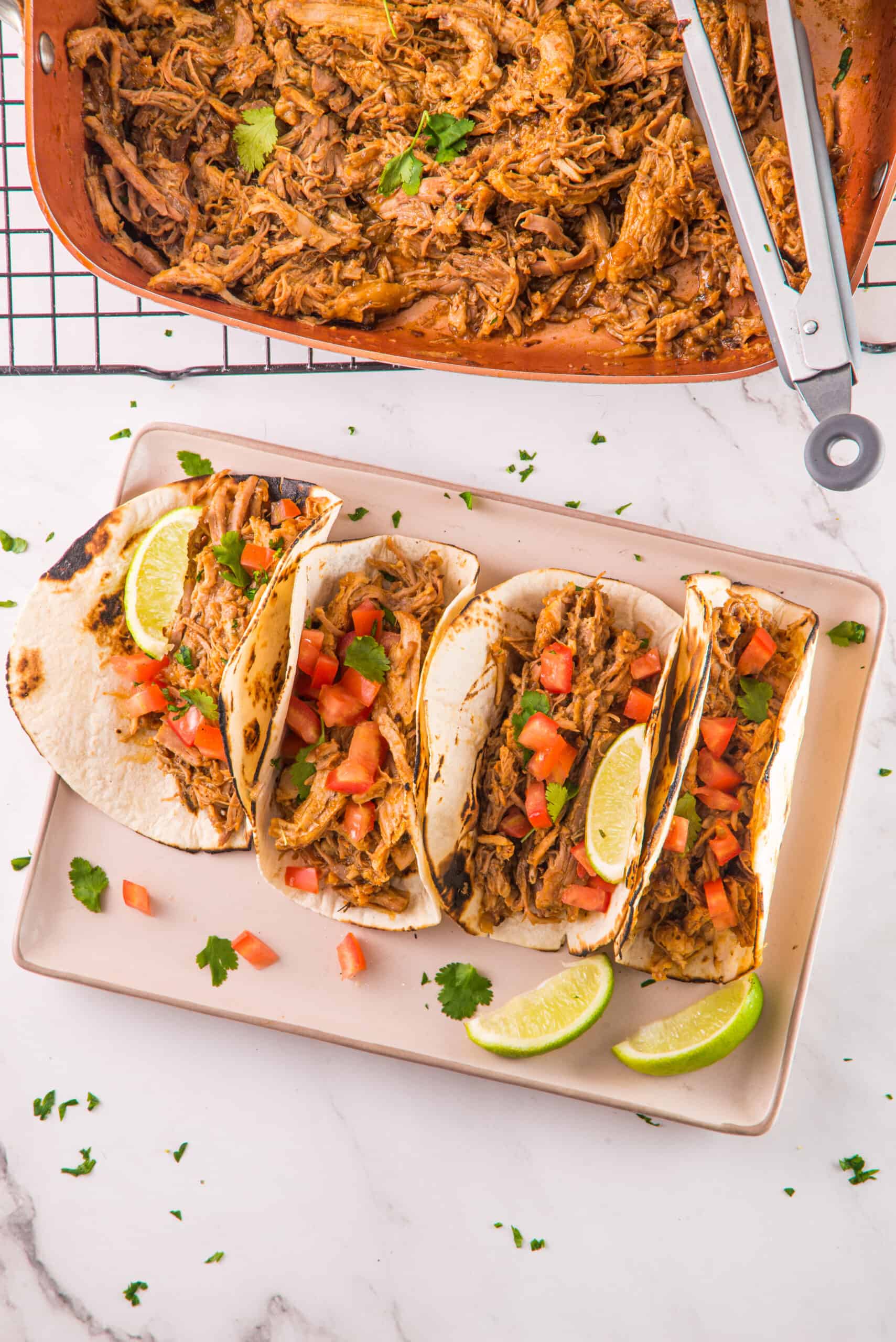 Pulled Pork Tacos in a pan and prepared on a serving dish
