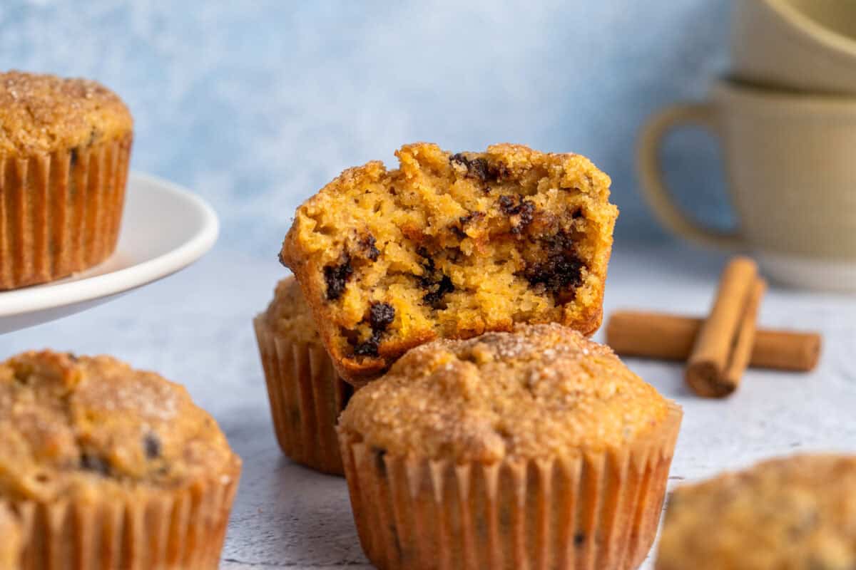 Gluten free pumpkin muffins with one broken in half