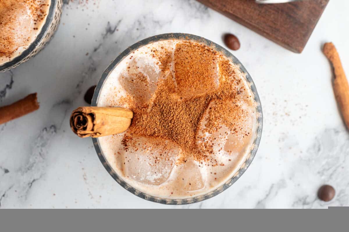 Top down of pumpkin spice white russian garnished with cinnamon bark